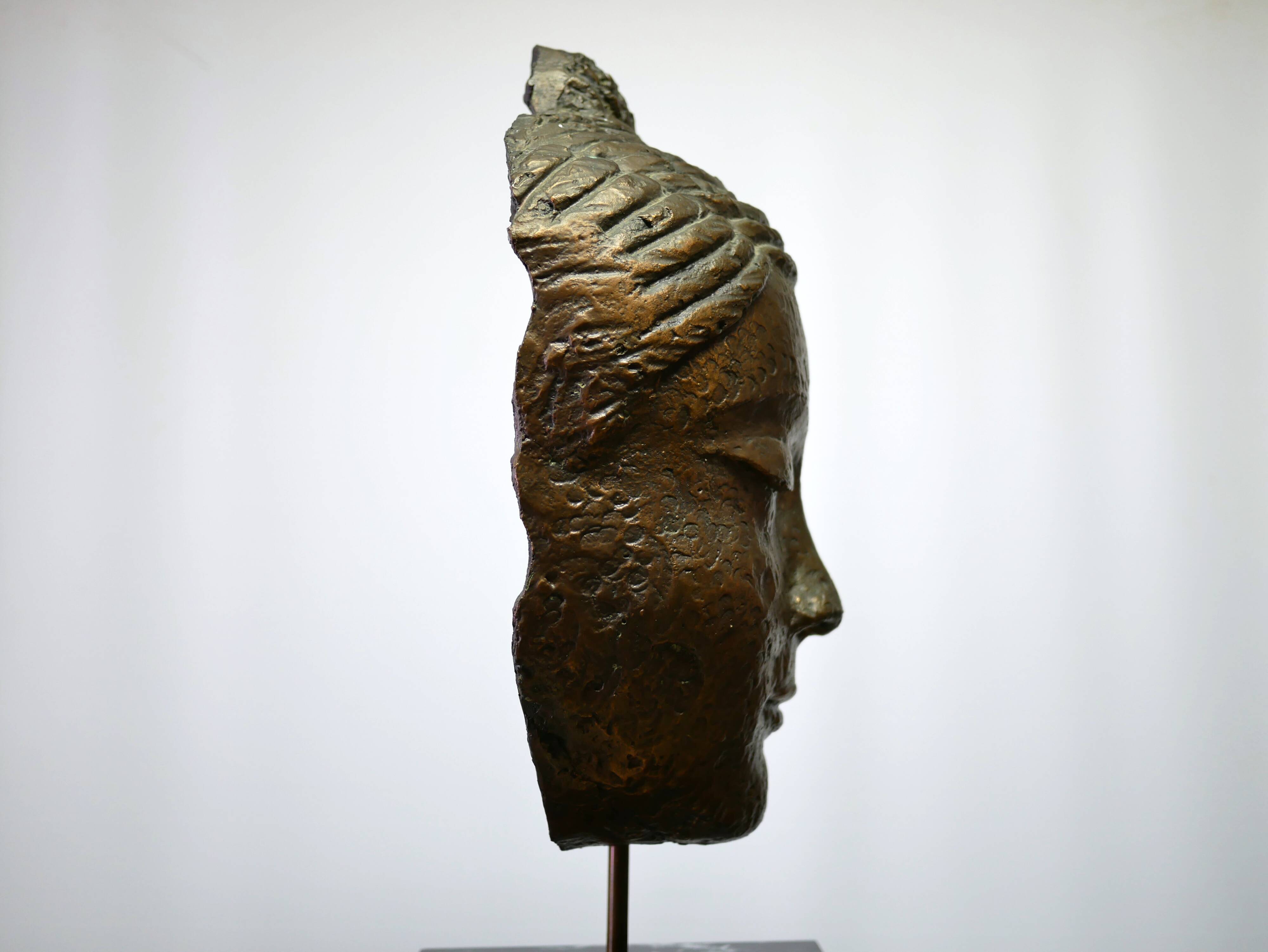 Buddha head sculpture, marble base