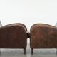 Elegant set of two sheepskin leather armchairs with beautiful round shapes