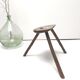 Brutalist tripod stool in solid wood half round