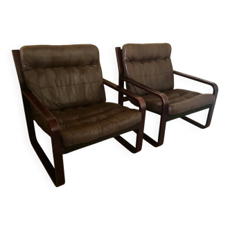 Pair of vintage armchairs in curved wood with suspended seat circa 1970-80.