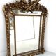 Louis XVI style mirror with parecloses in wood and gilded stucco, 19th century