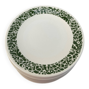 Set of 10 ceramic plates with green foliage decoration.