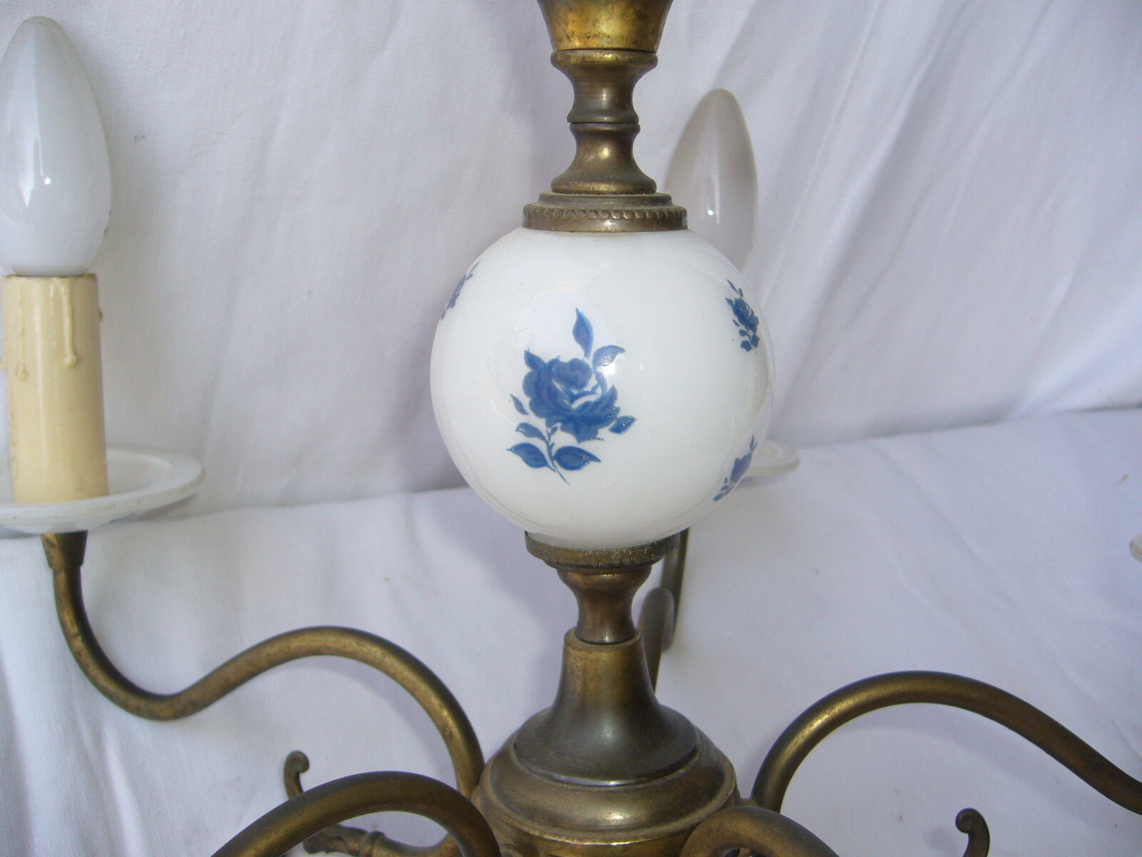 Brass chandelier and Dutch-style earthenware. Vintage