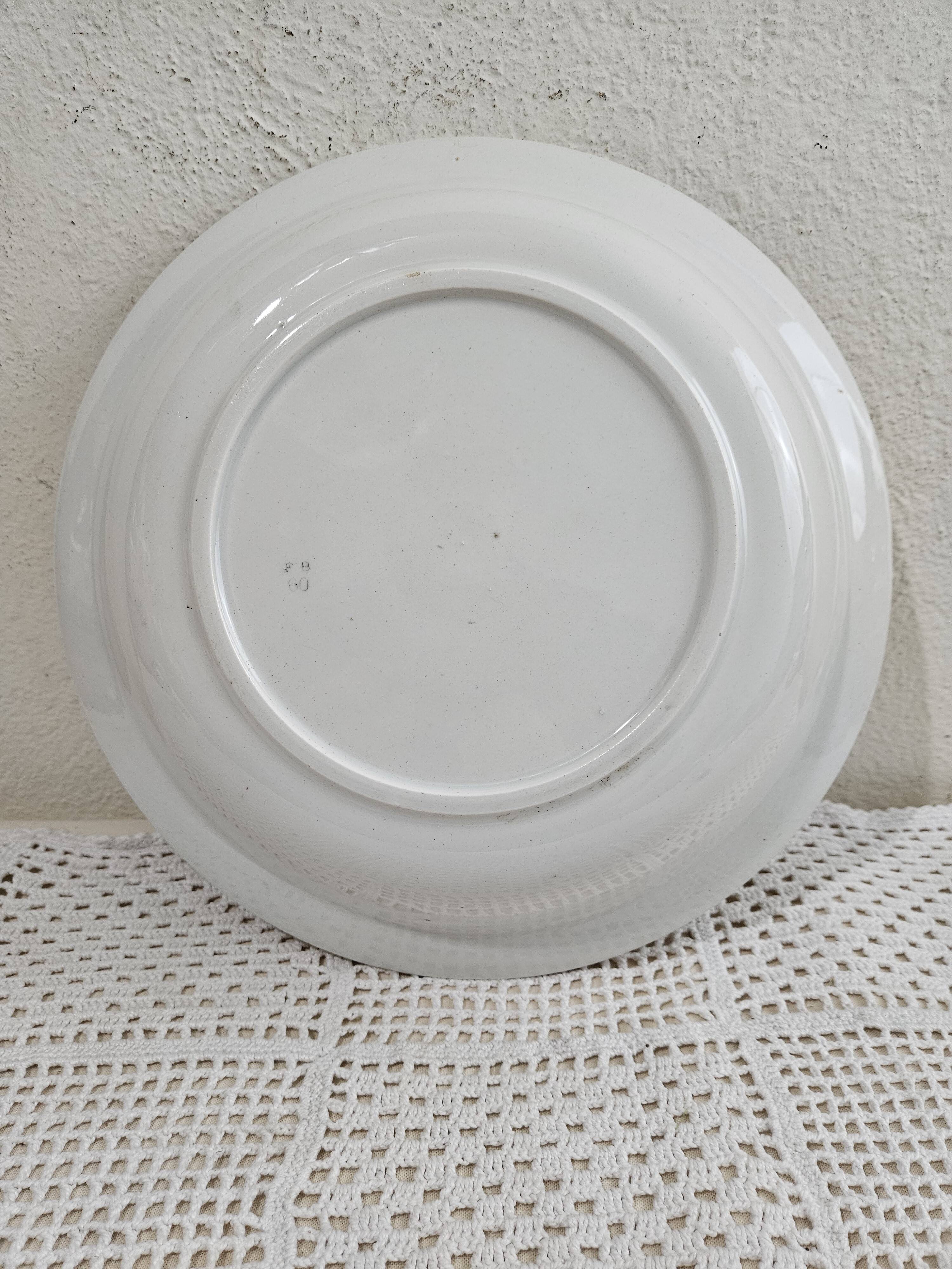 Plat creux en faïence de Badonviller