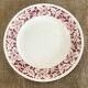 Round serving dish with burgundy red floral pattern