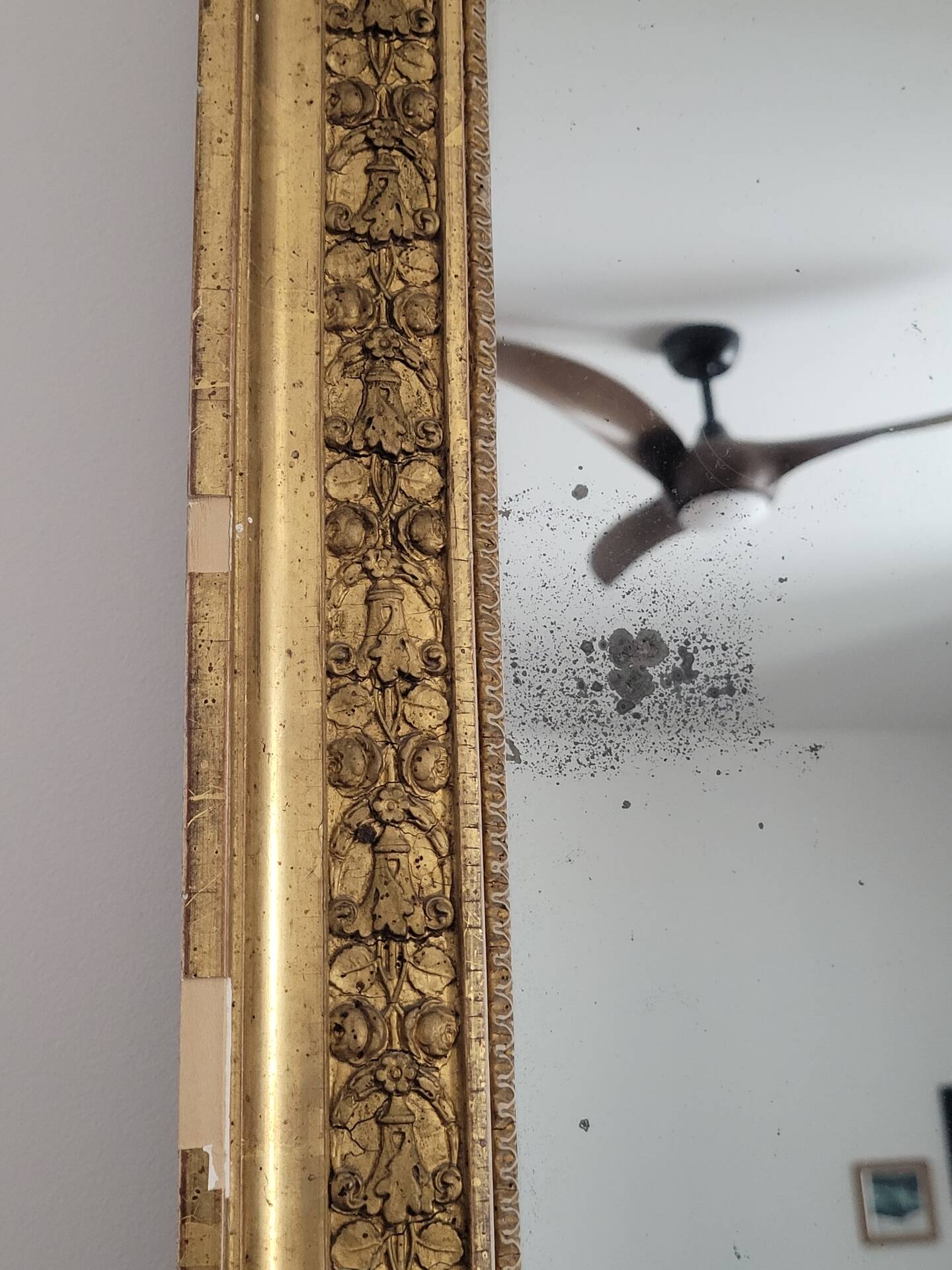 Golden stucco and wood Empire mirror
