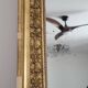Golden stucco and wood Empire mirror