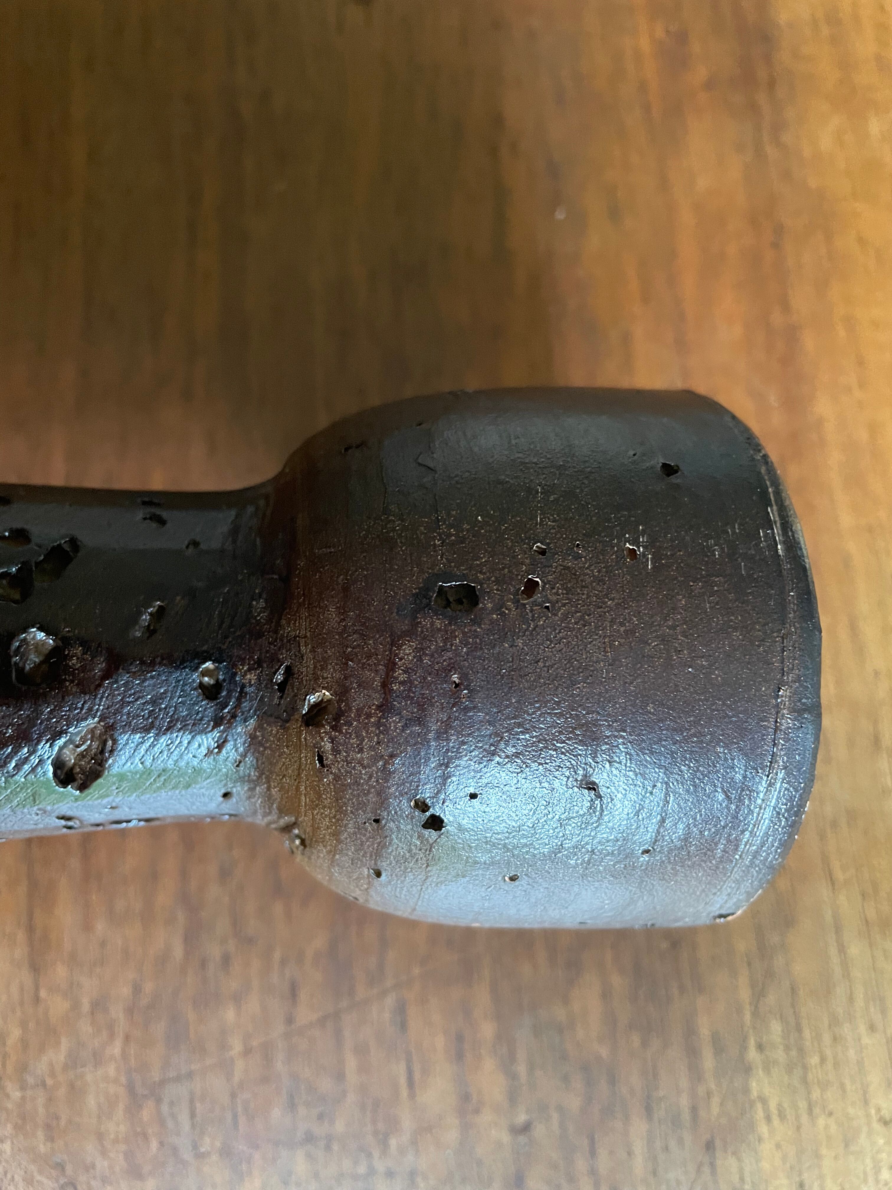 Brown enamelled terracotta candle holder