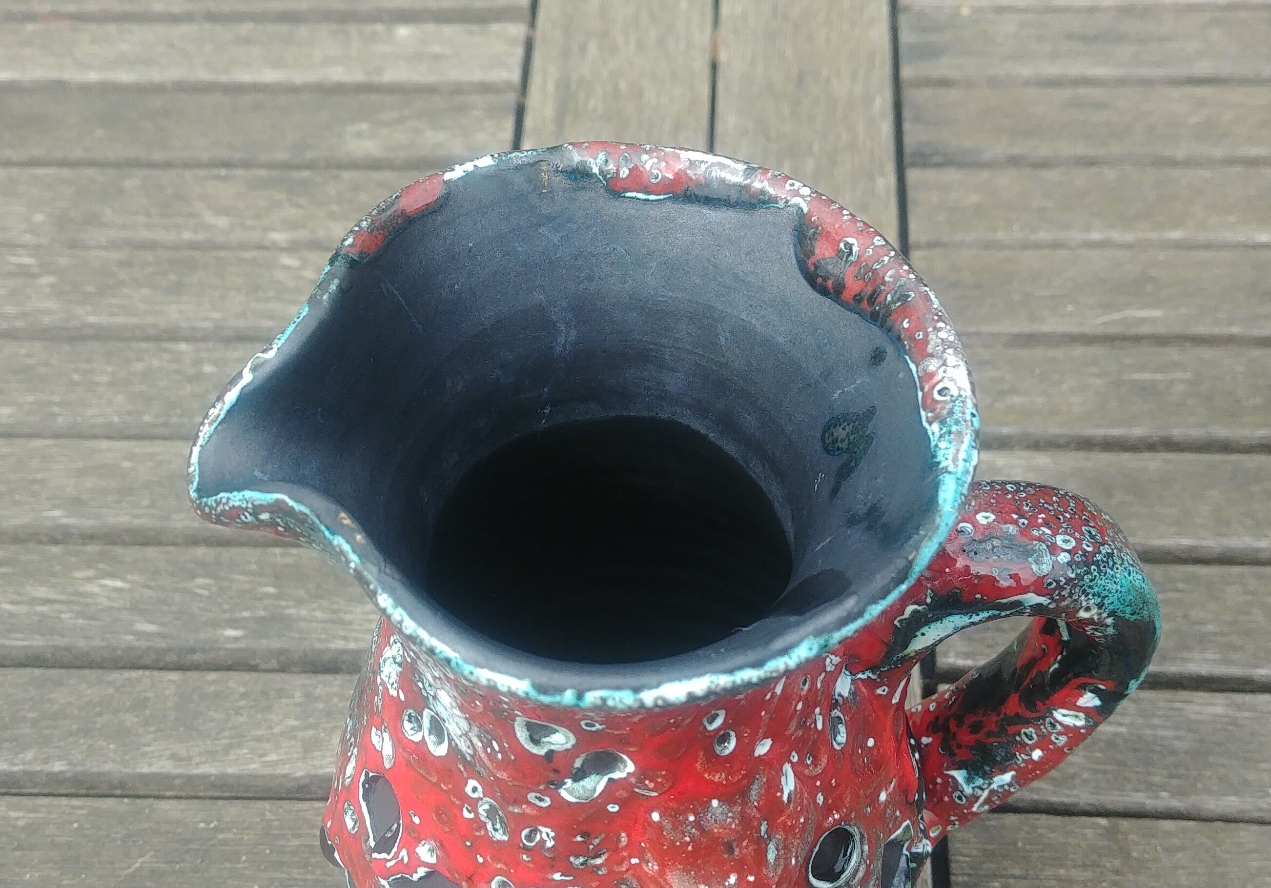 Glazed ceramic pitcher in Fat Lava style