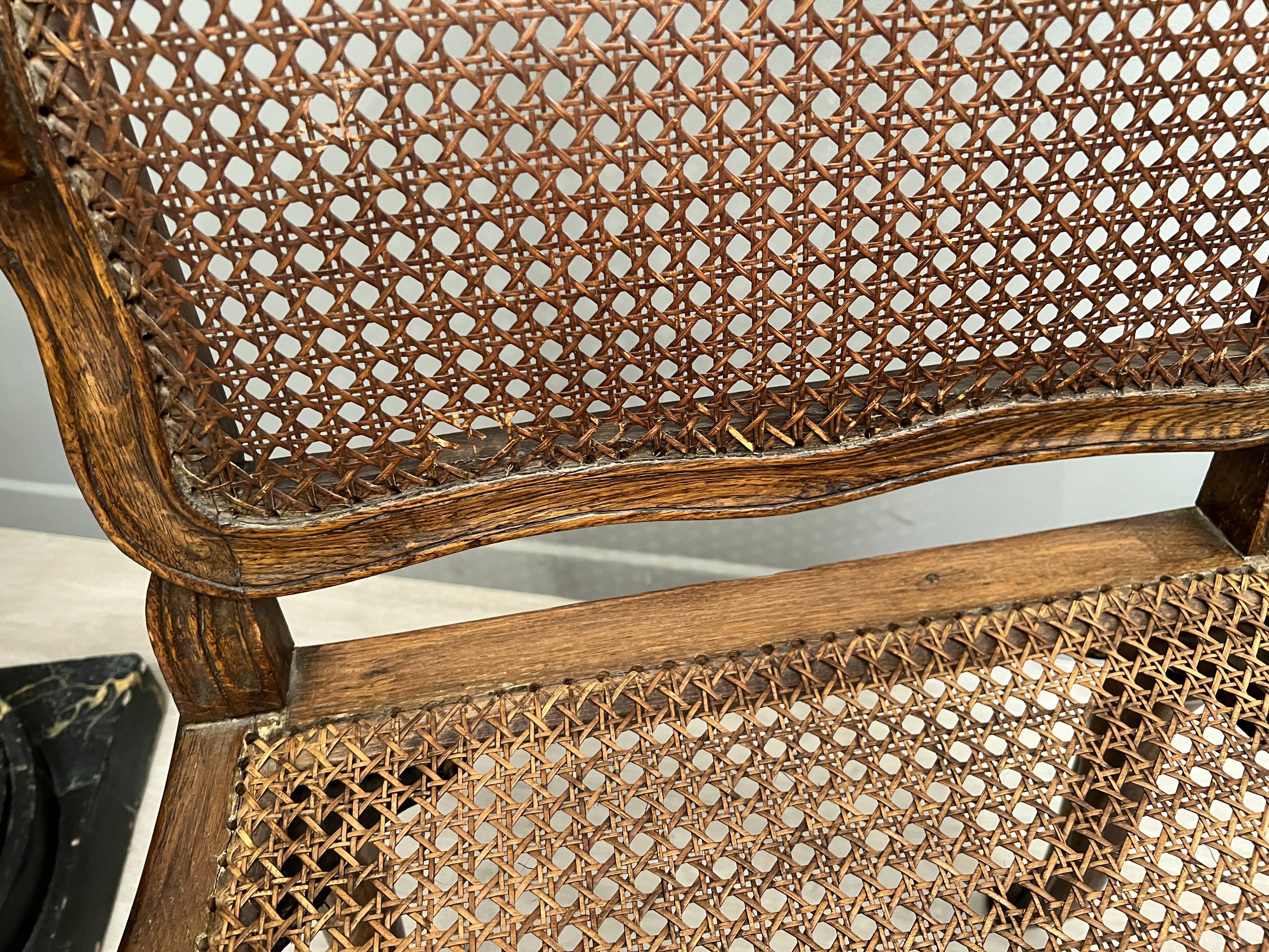 Paire de fauteuils cannés moulures et sculptes d'epoque régence