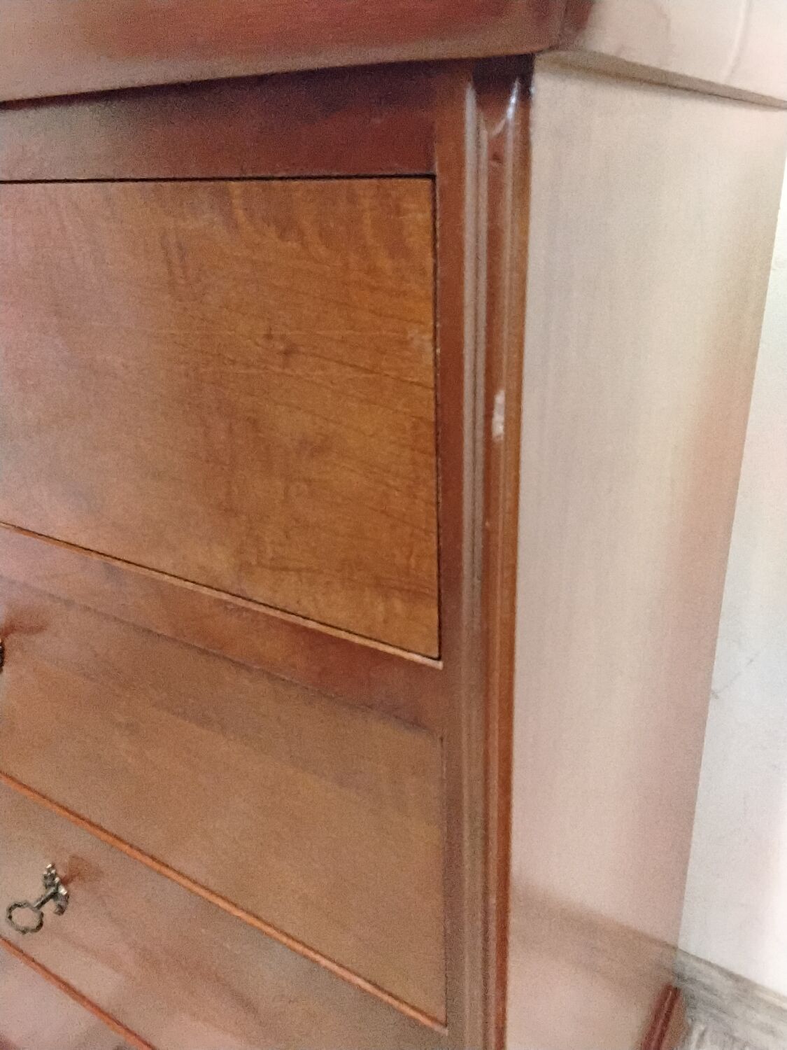 Wooden chest of drawers with a secret drawer