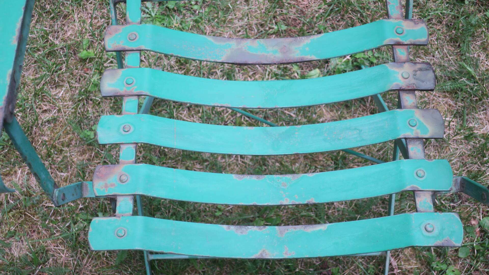 Pair of mid century distressed painted iron garden chairs