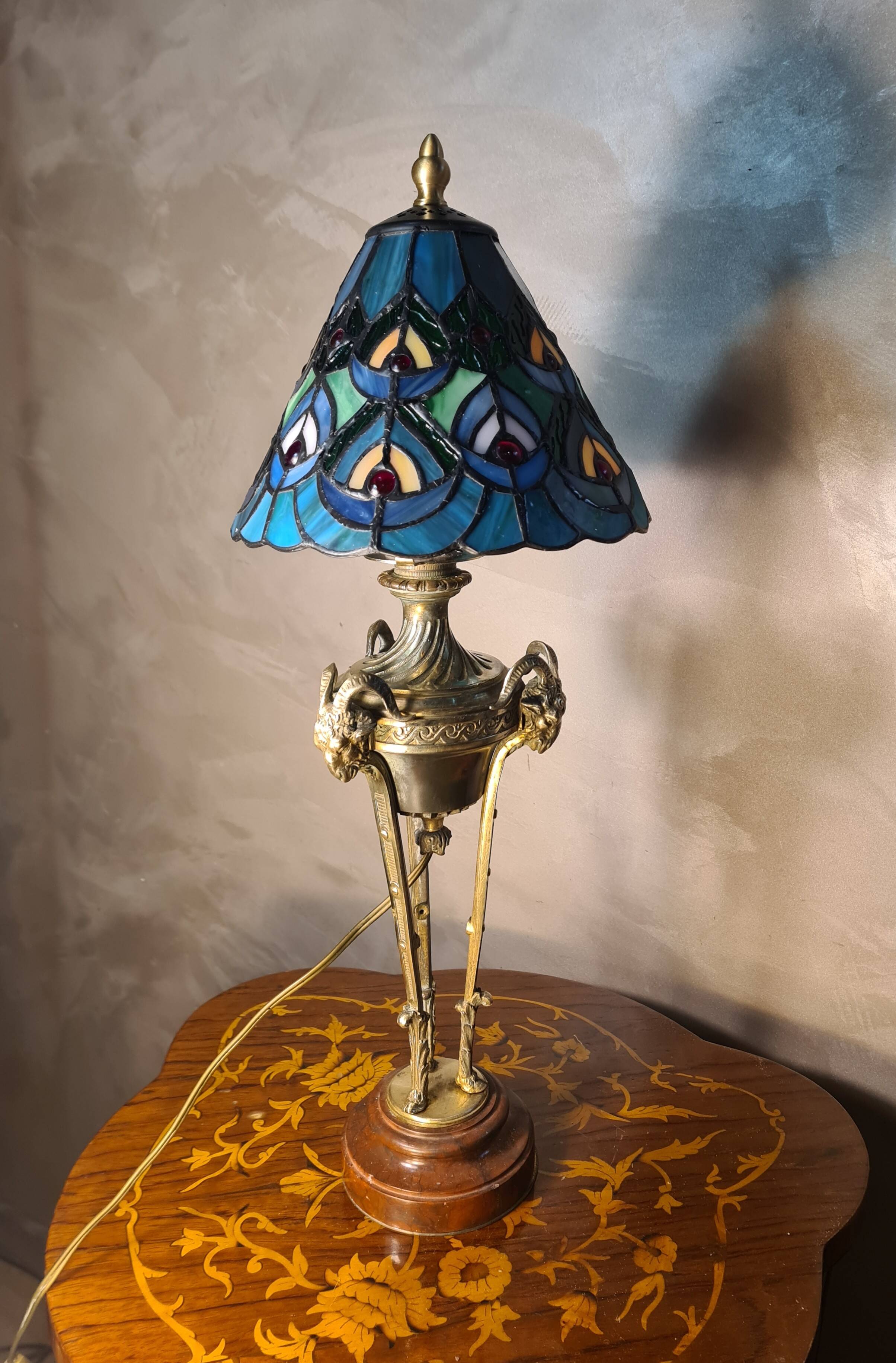 bronze lamp with a goat's head from the 19th century and a stained glass lampshade soldered with lead