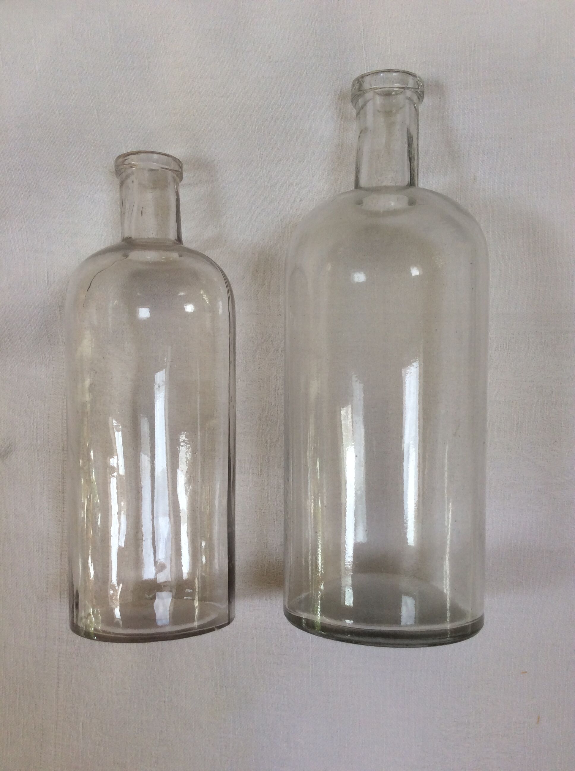 Pair of former pharmaceutical glass bottles