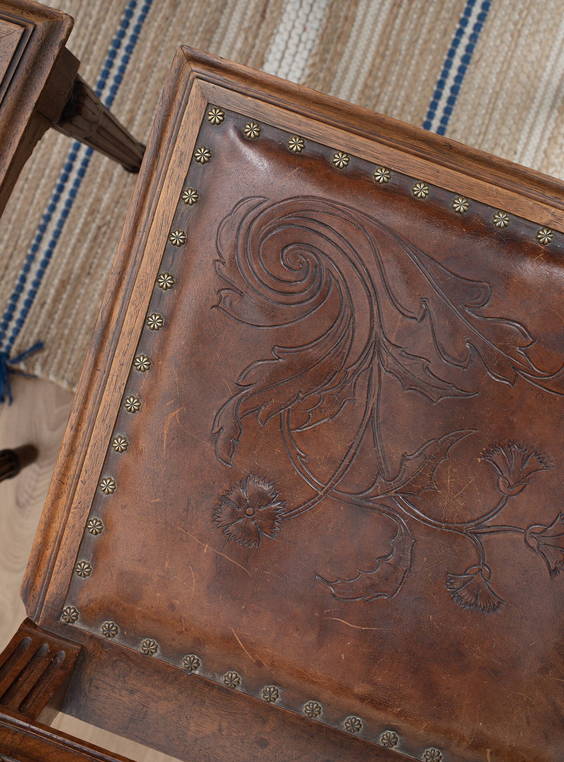 Set of 4 Louis XVI style chairs in carved wood and embossed leather.
