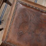 Set of 4 Louis XVI style chairs in carved wood and embossed leather.