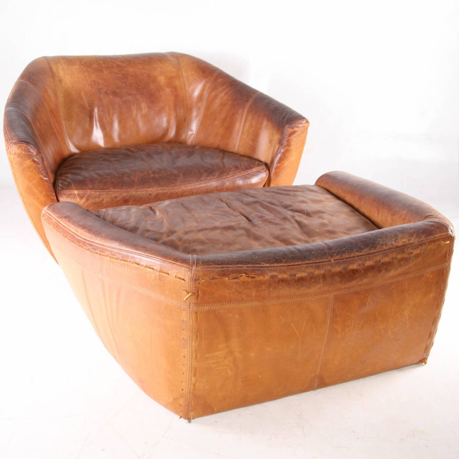 Grands fauteuil et ottoman en cuir