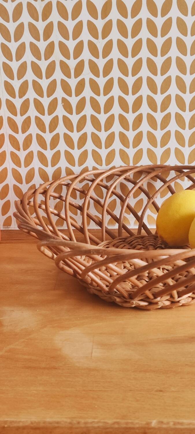 Vintage woven wicker round basket for fruits or bread.