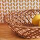 Vintage woven wicker round basket for fruits or bread.