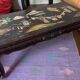 Chinese black lacquer coffee table with figurative decoration – Coromandel style – 20th century.