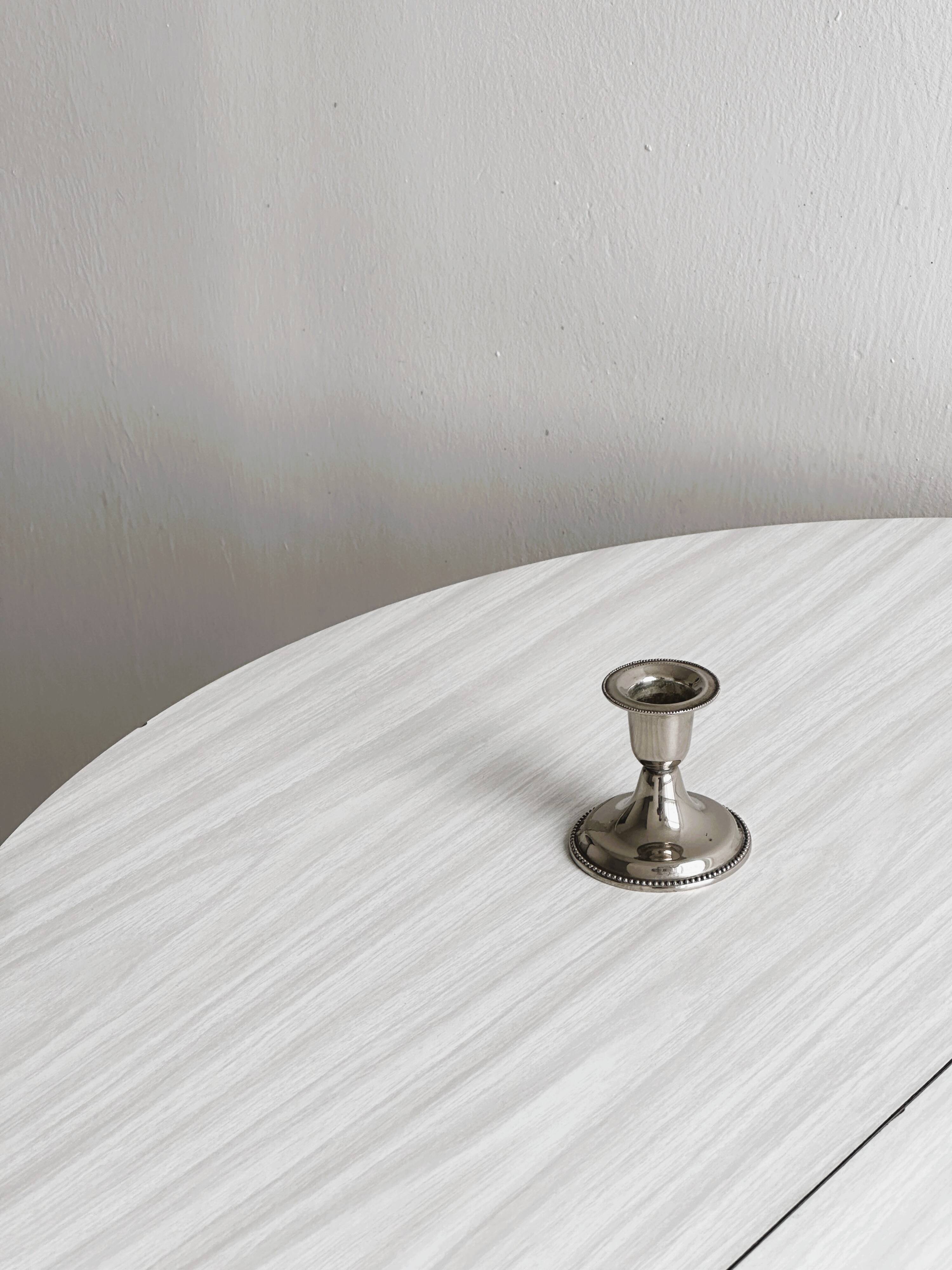 Small antique metal candle holder