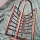 Dark rattan magazine rack