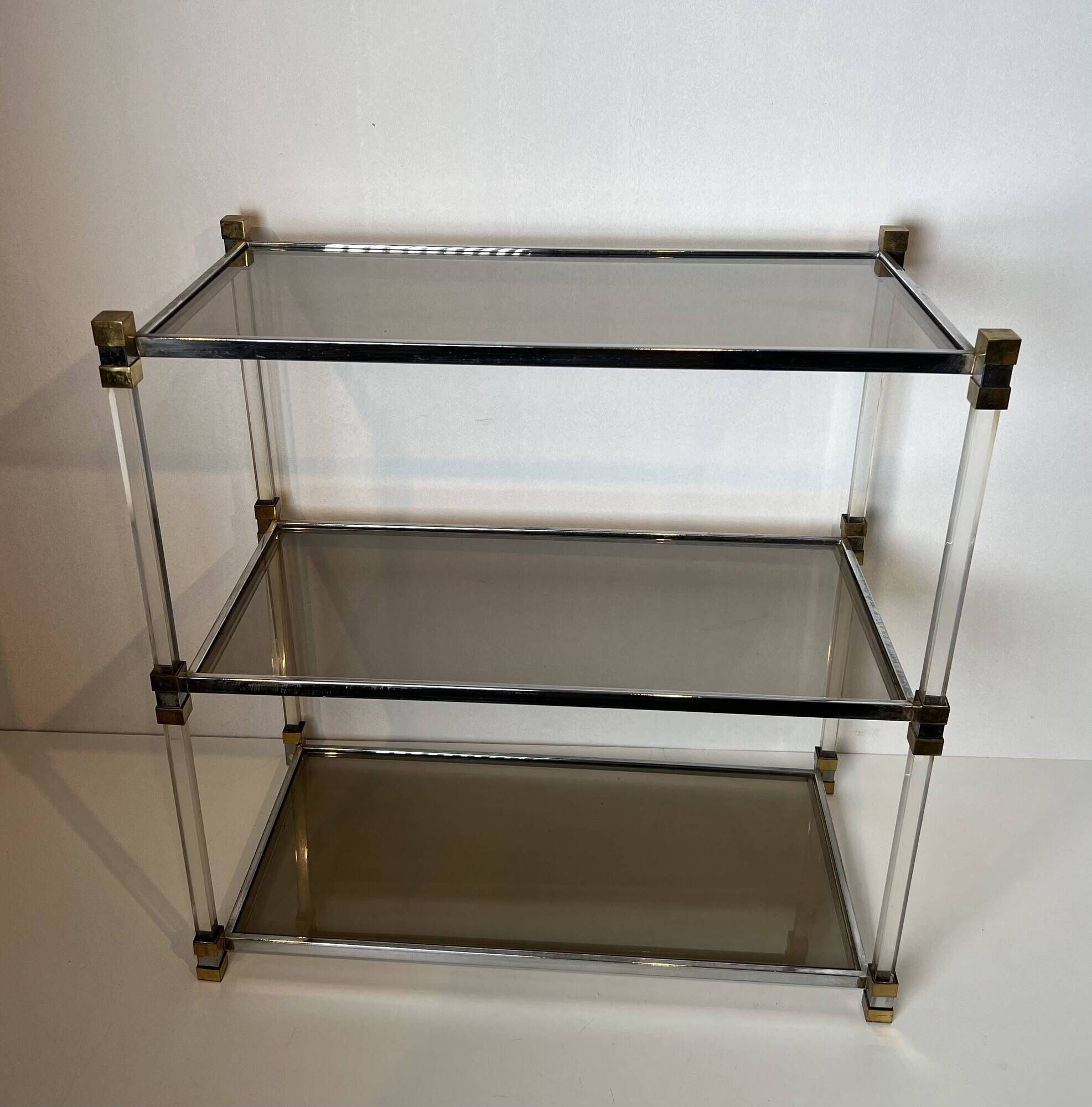 Lucite Shelf with Three Smoked Glass Shelves and Brass Ends. Work