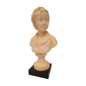old bust of a young child in ivory marble on black marble base