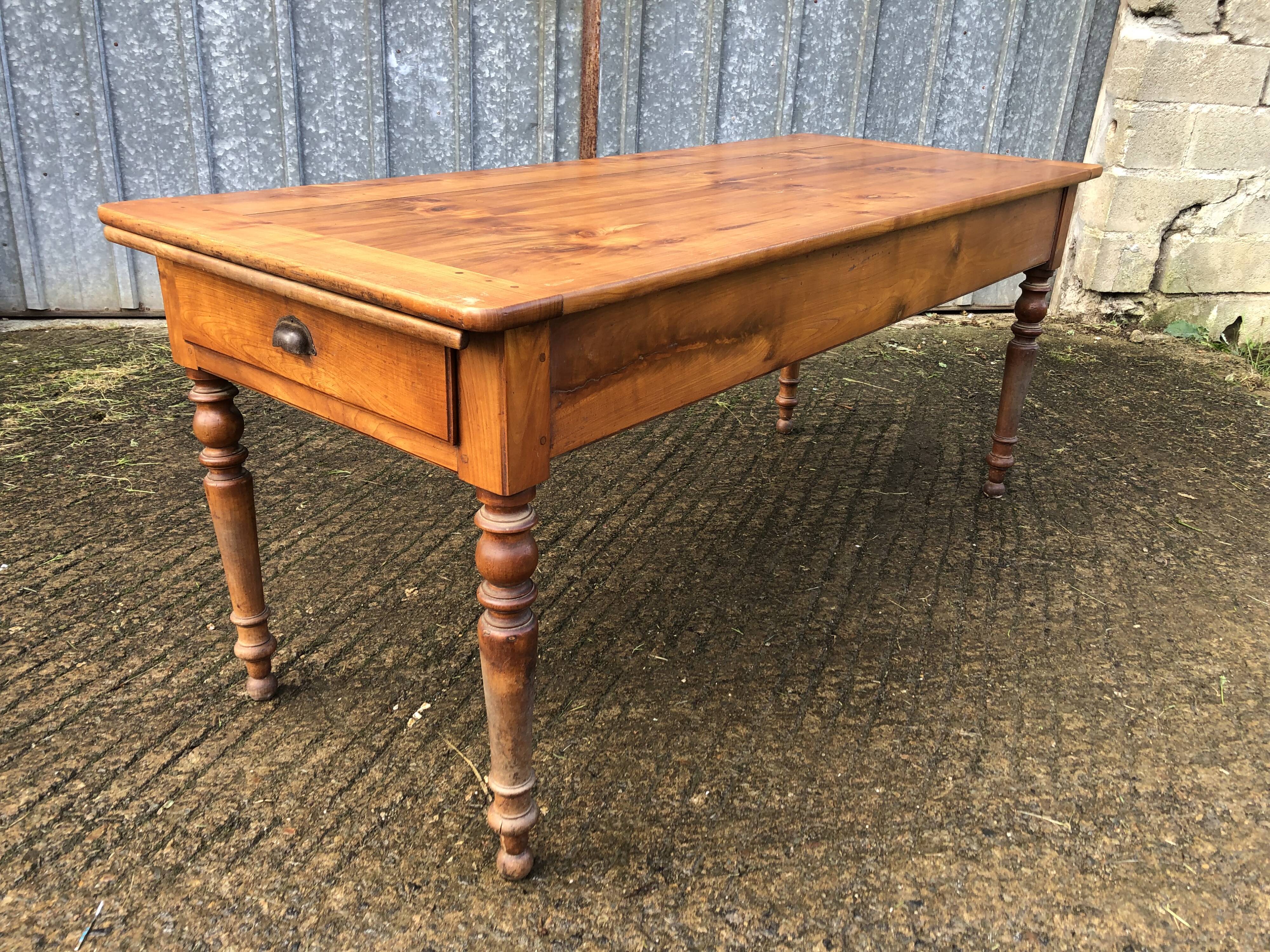 Antique farmhouse table in solid cherry wood in Louis Philippe style.