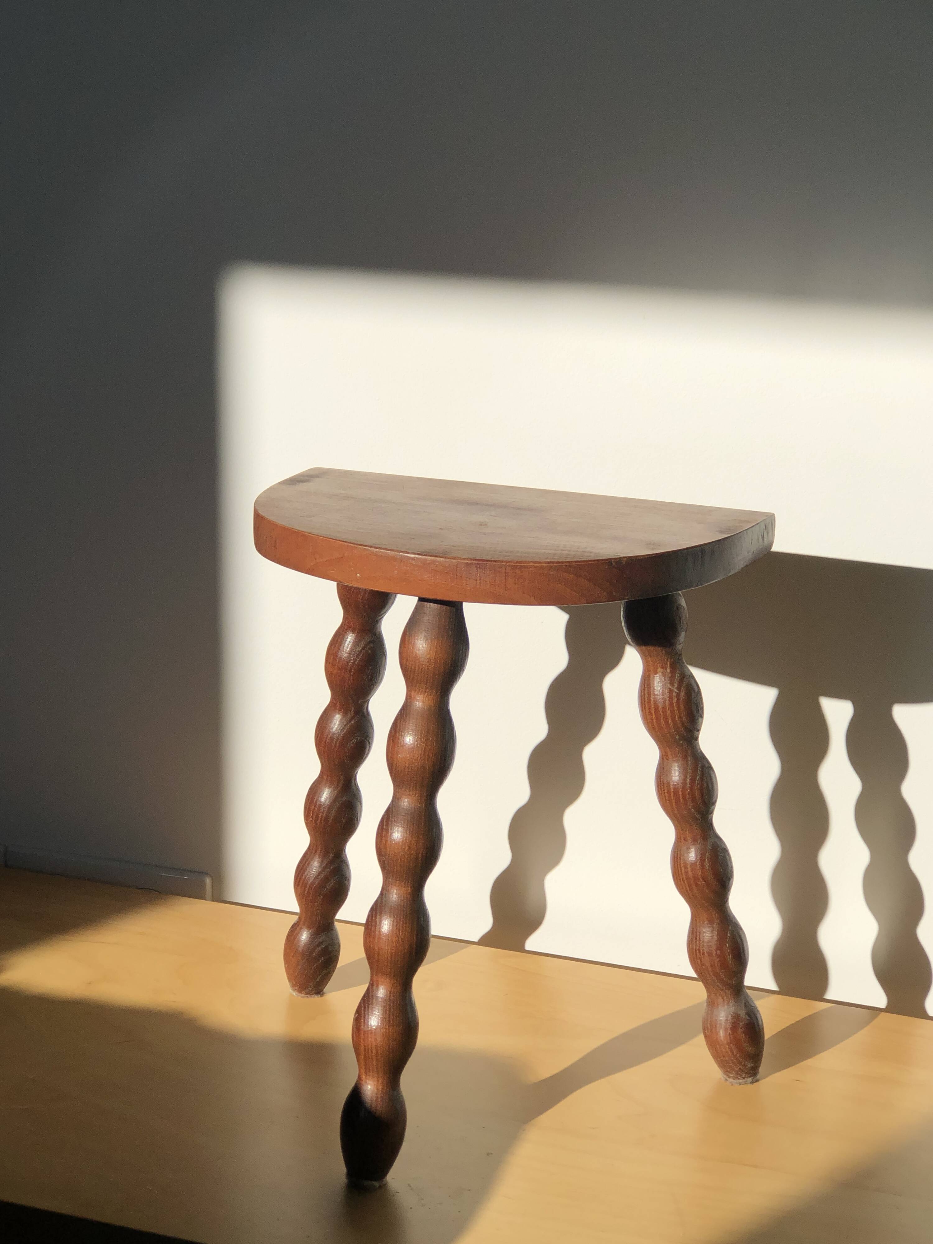 Turned wooden tripod stool