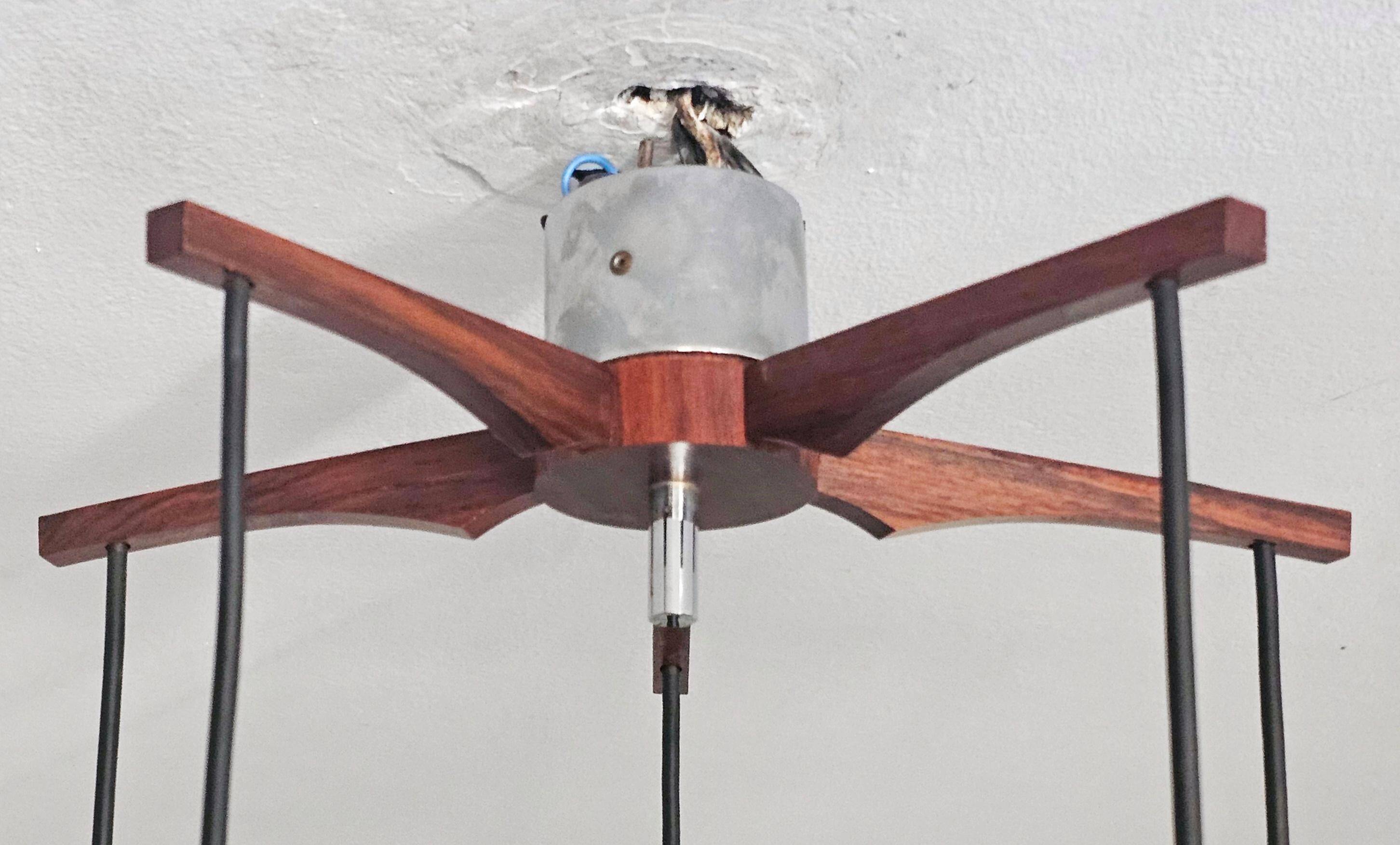 Mid Century Modern spider chandelier in teak, rosewood, and crystal.