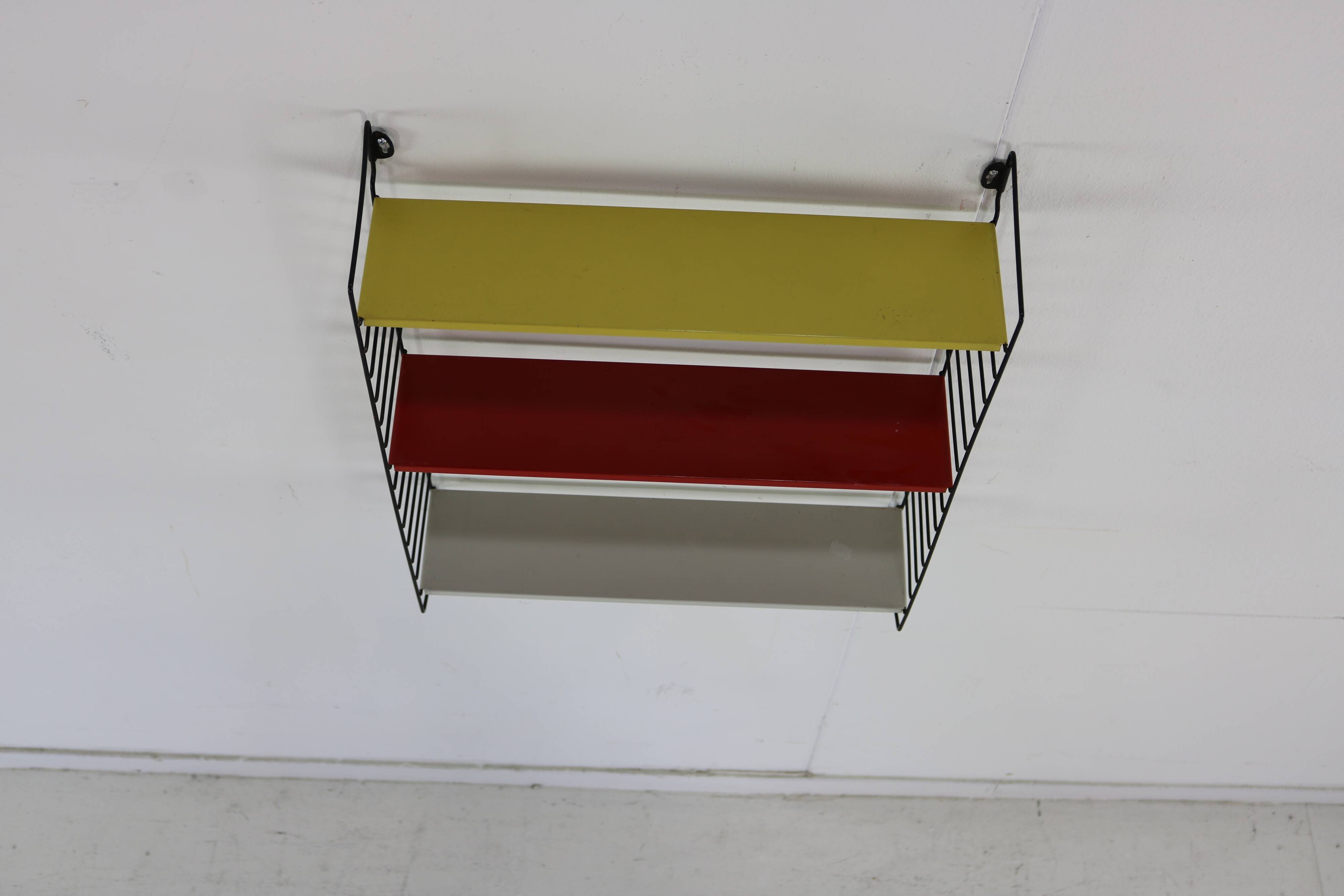 Minimalistic fifties metal metal wall system for Tomado Holland