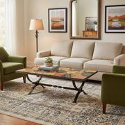 Vintage stone coffee table with a cast iron frame.