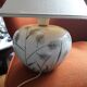 Antique ceramic lamp with a floral design.
