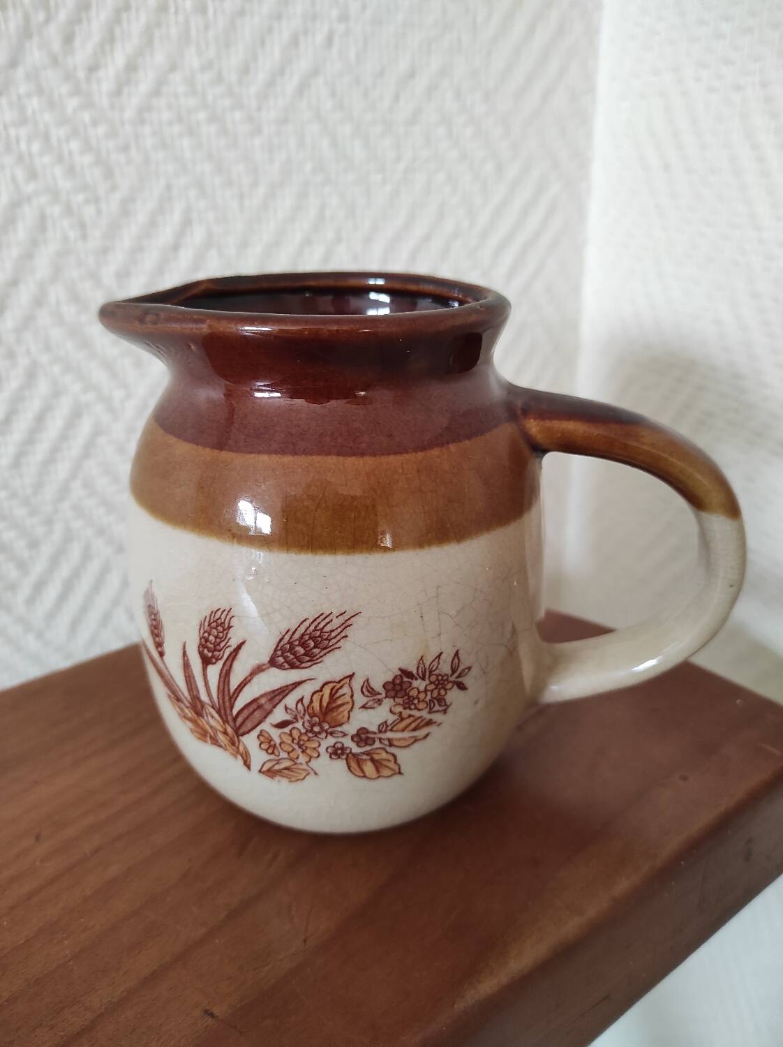 Glazed ceramic pitcher