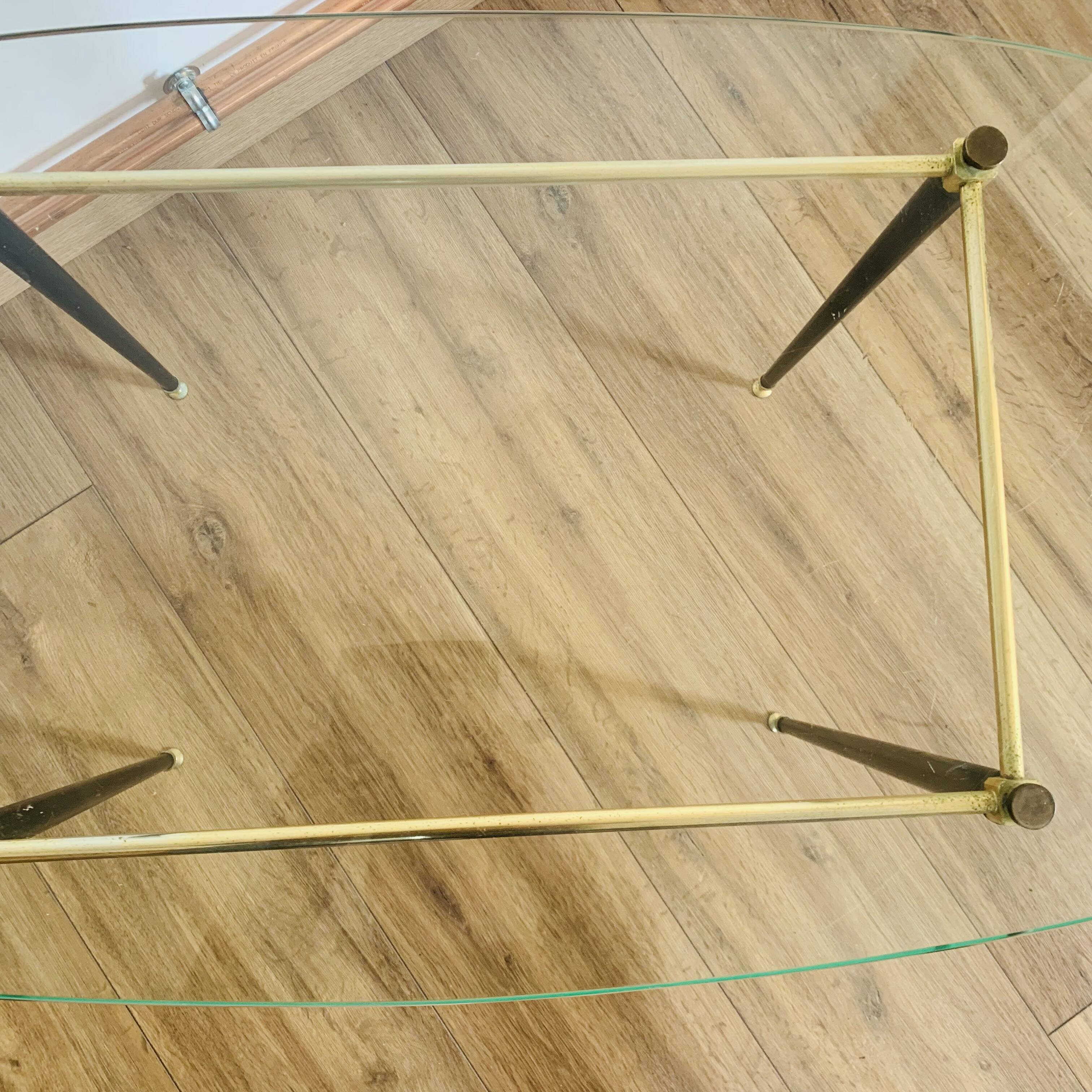 Coffee table from the 50s/60s, glass, brass, black metal.