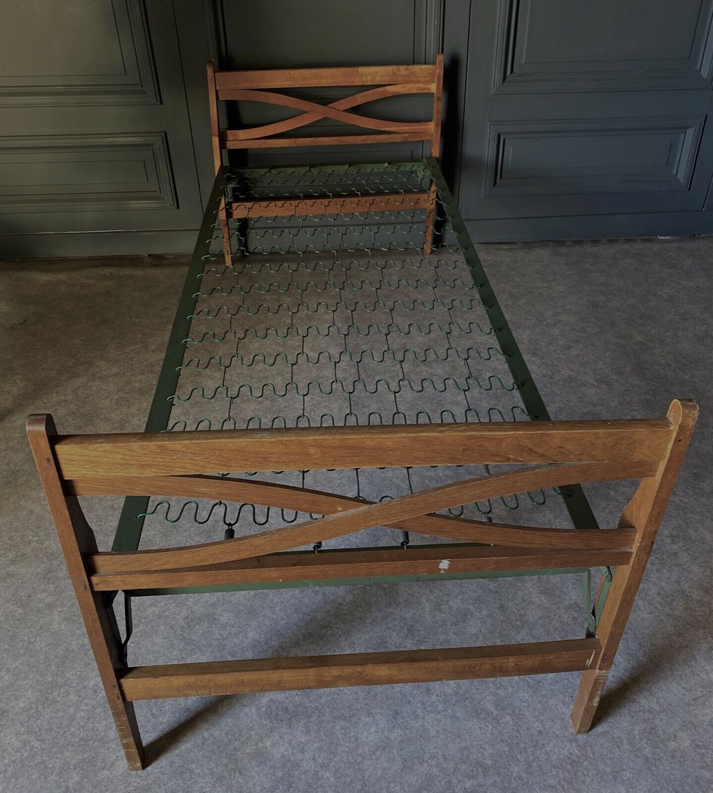 Bed with green metal braces 1960 a person foldable