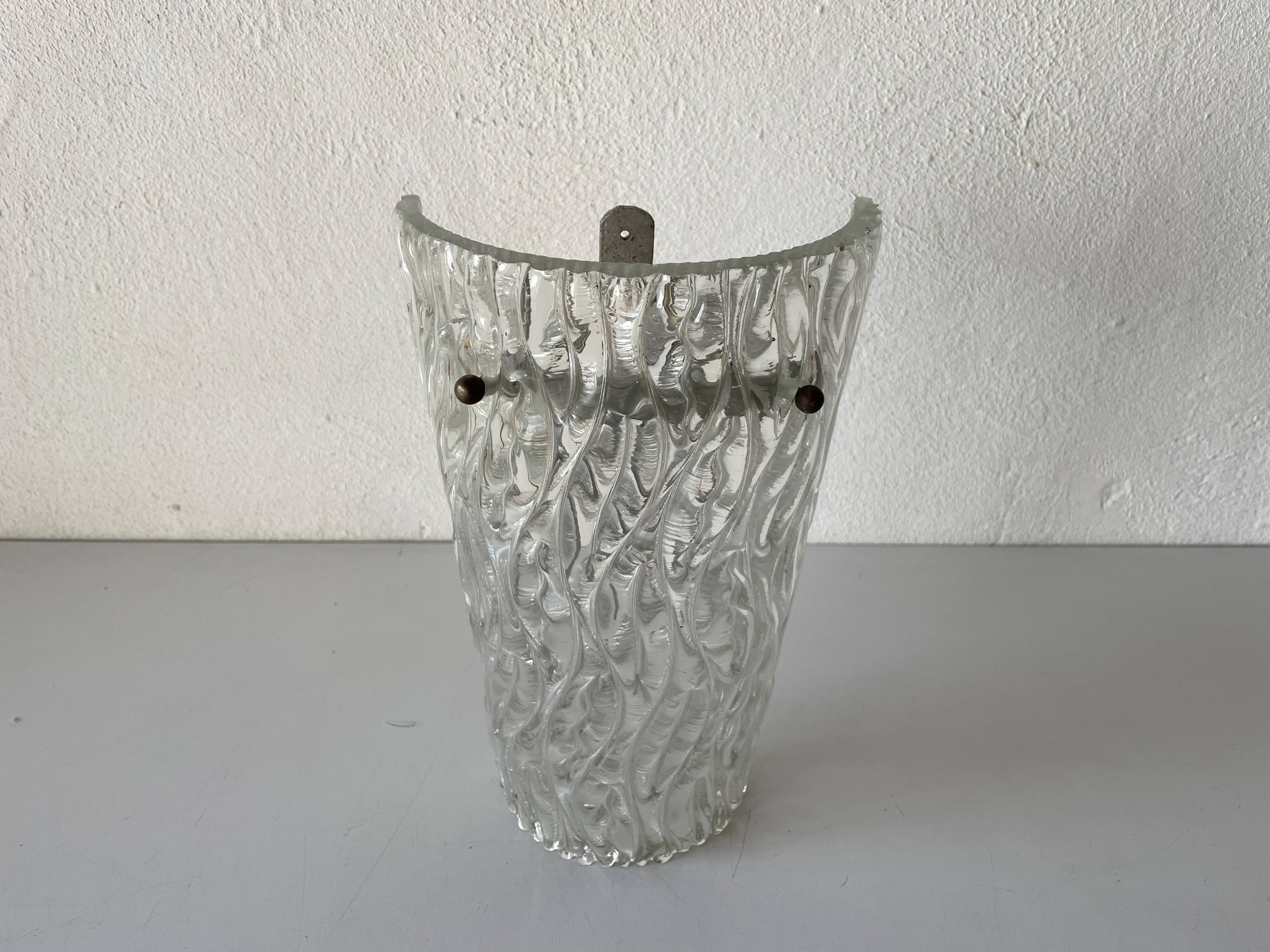 Simple arch-shaped wall light in textured glass, 1950s, Germany.