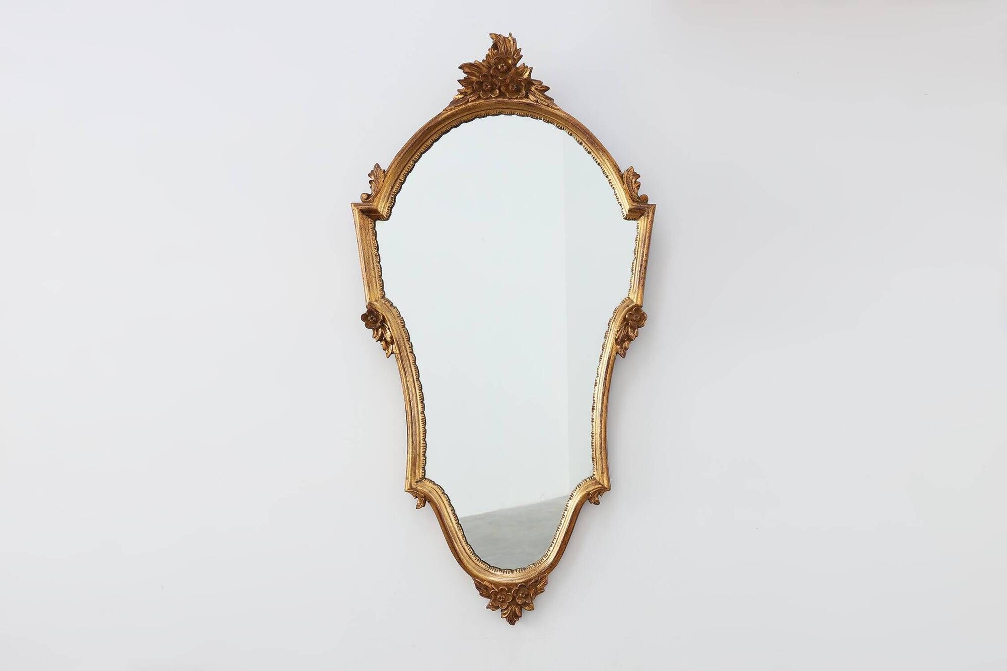 20th Century Louis XVI style giltwood mirror with ornate crest, France