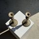 Pair of classic candlesticks in patinated gold metal H25