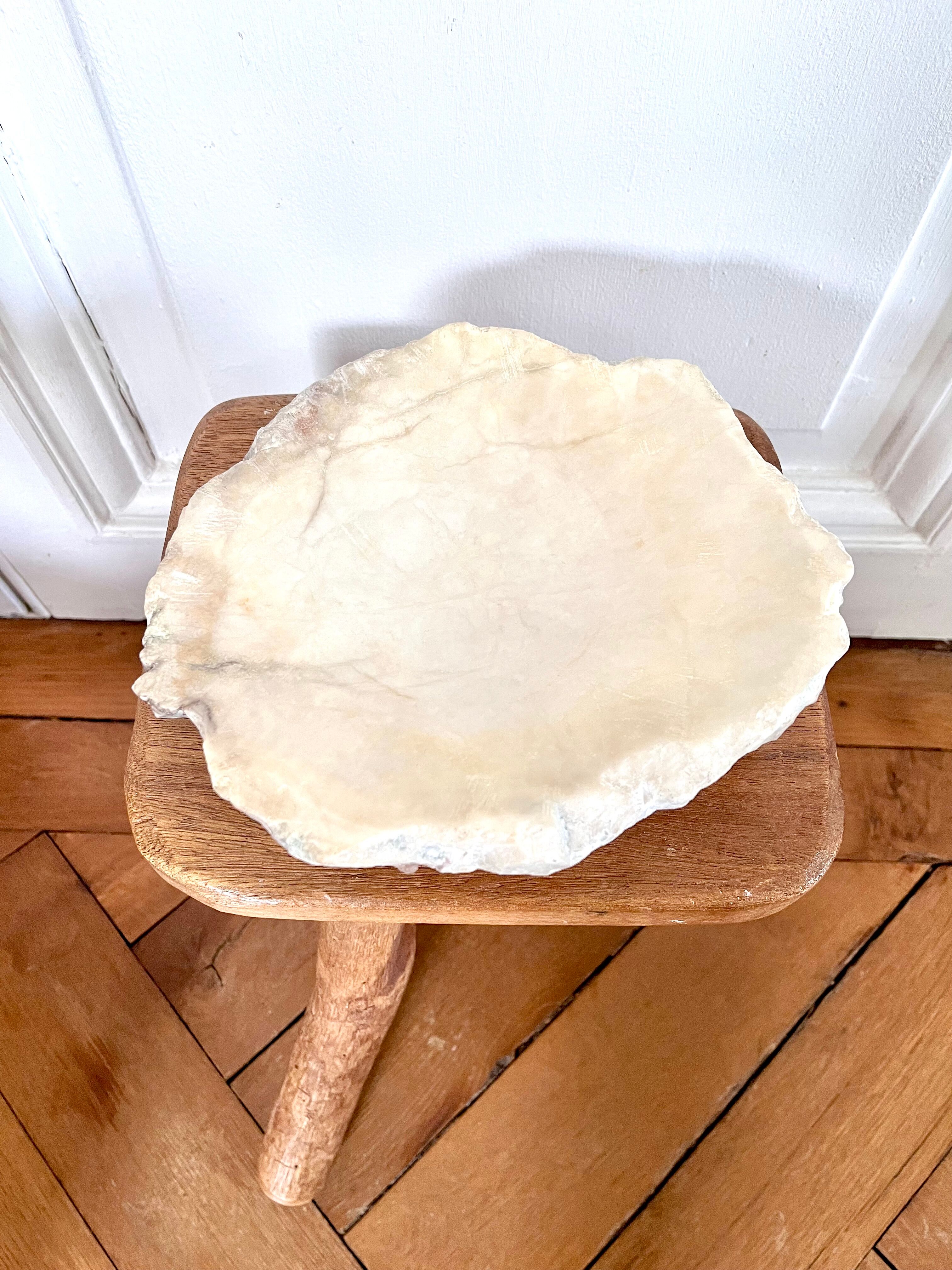 Large ashtray dish made of marbled alabaster.
