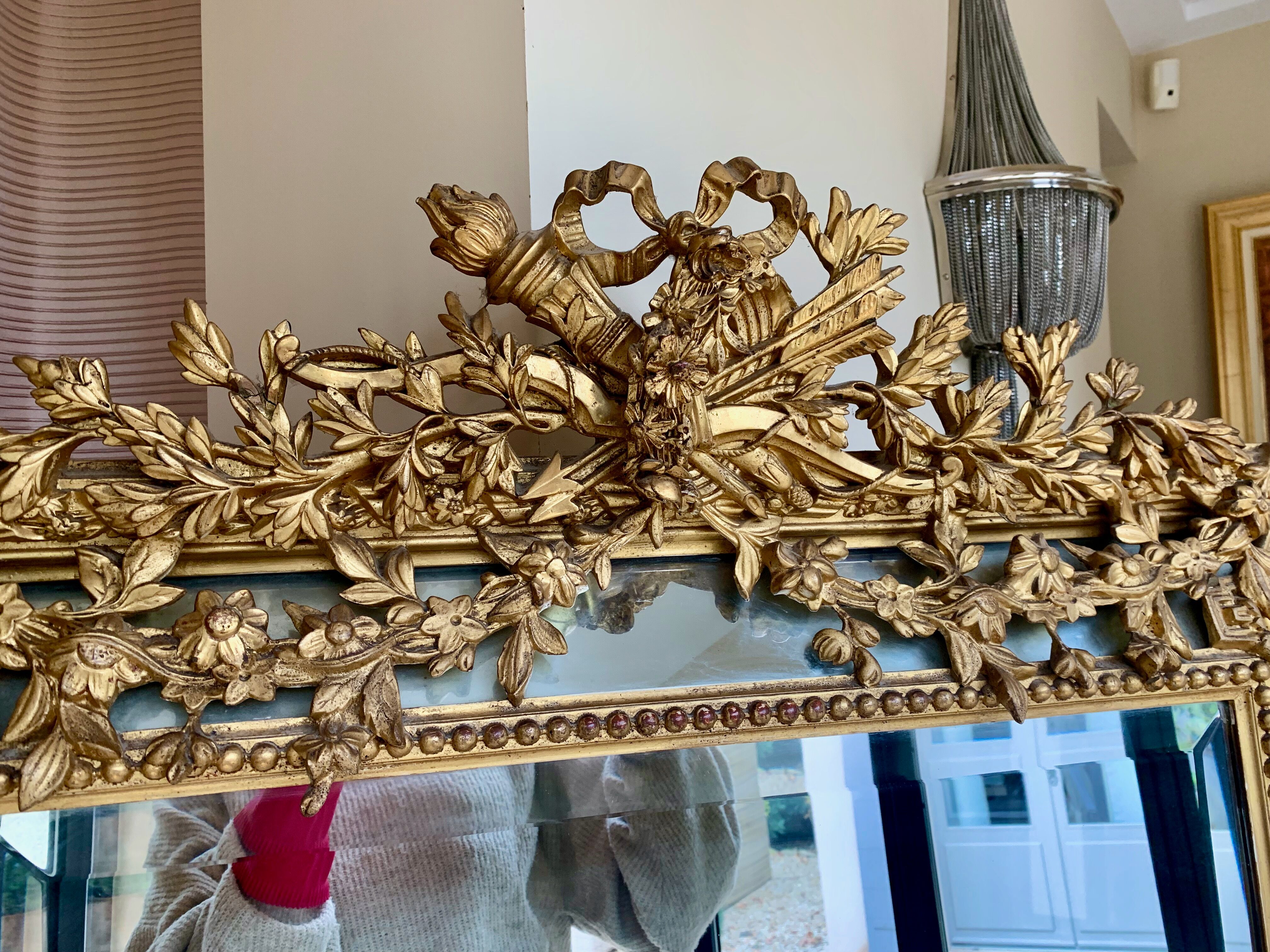 Large mirror style Louis XVI in gilded wood with parecloses xixth h: 165 cm