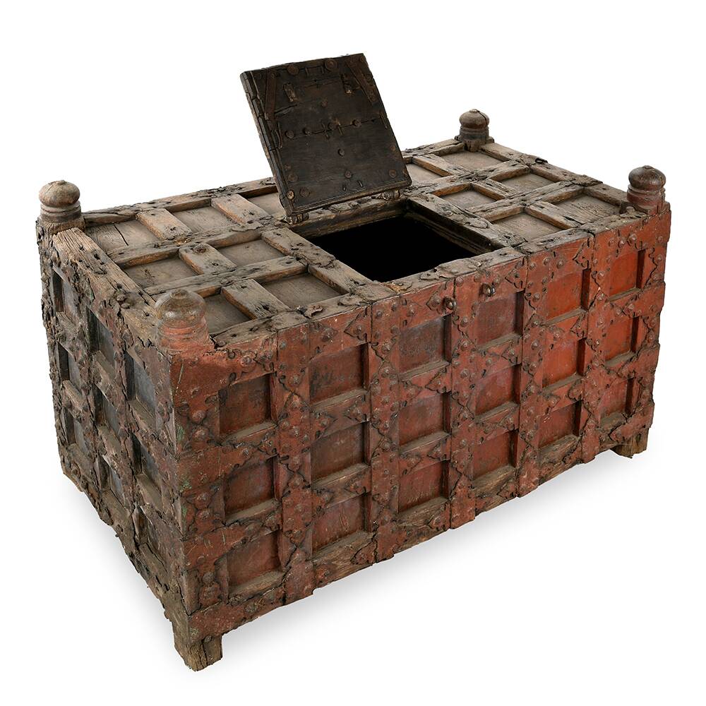 Large wooden and metal chest with red patina