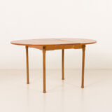 Teak round table with hidden extension, 1970s