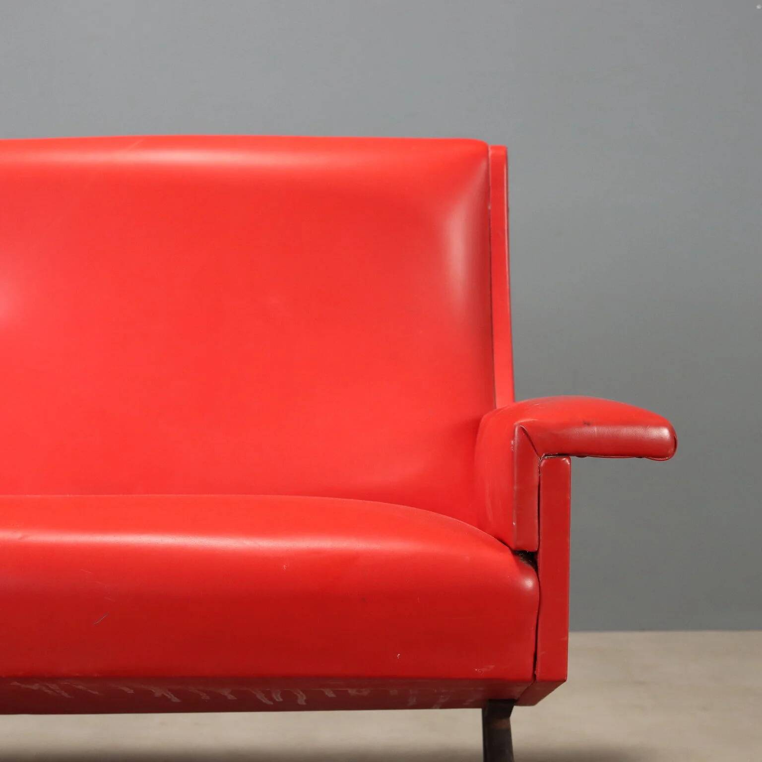Vintage red faux leather sofa from the 1960s.