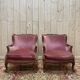 Paire de fauteuils - bergères de style Louis XV en velours rose