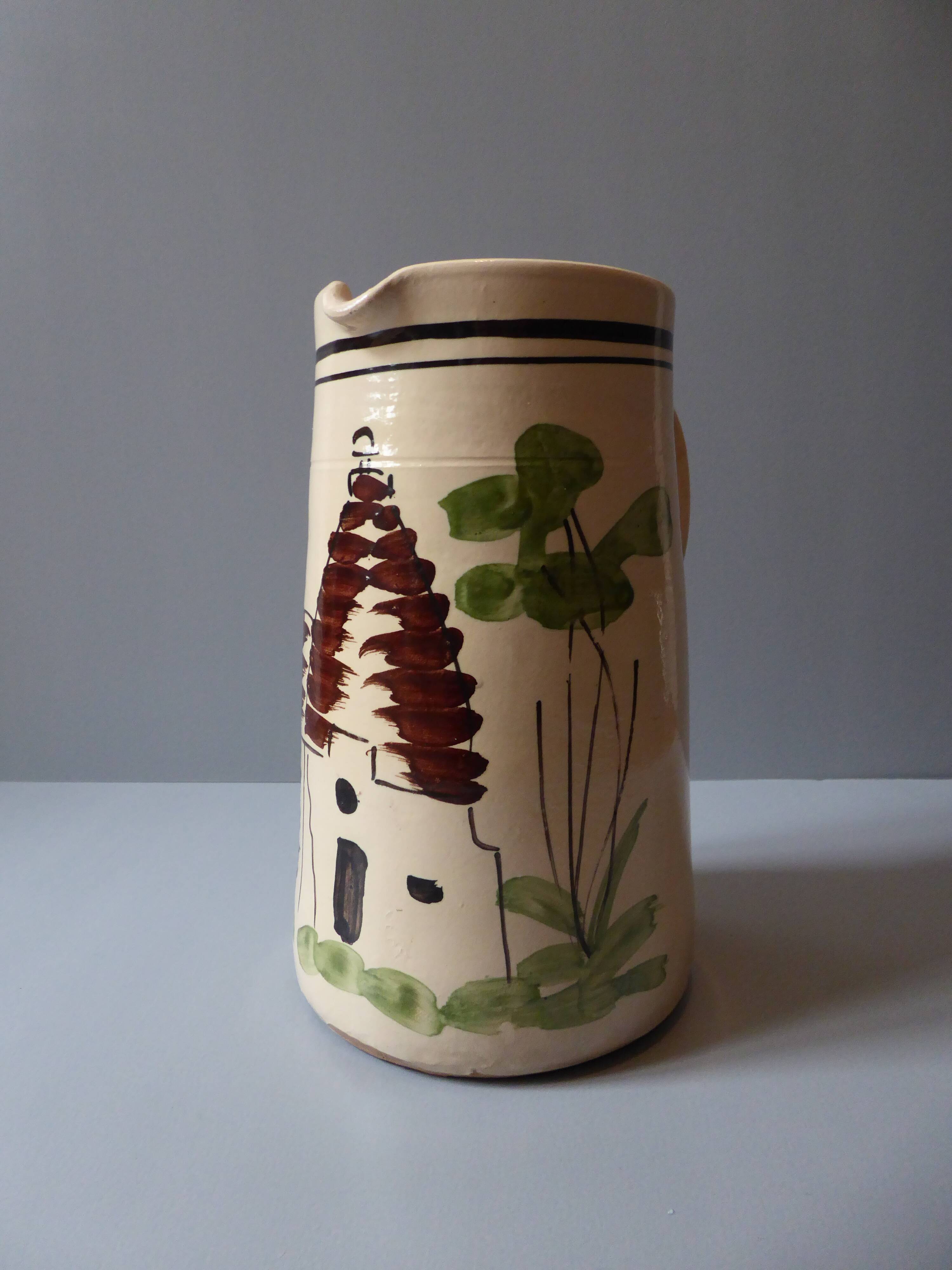A pitcher in earthenware with a country décor