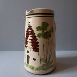 A pitcher in earthenware with a country décor