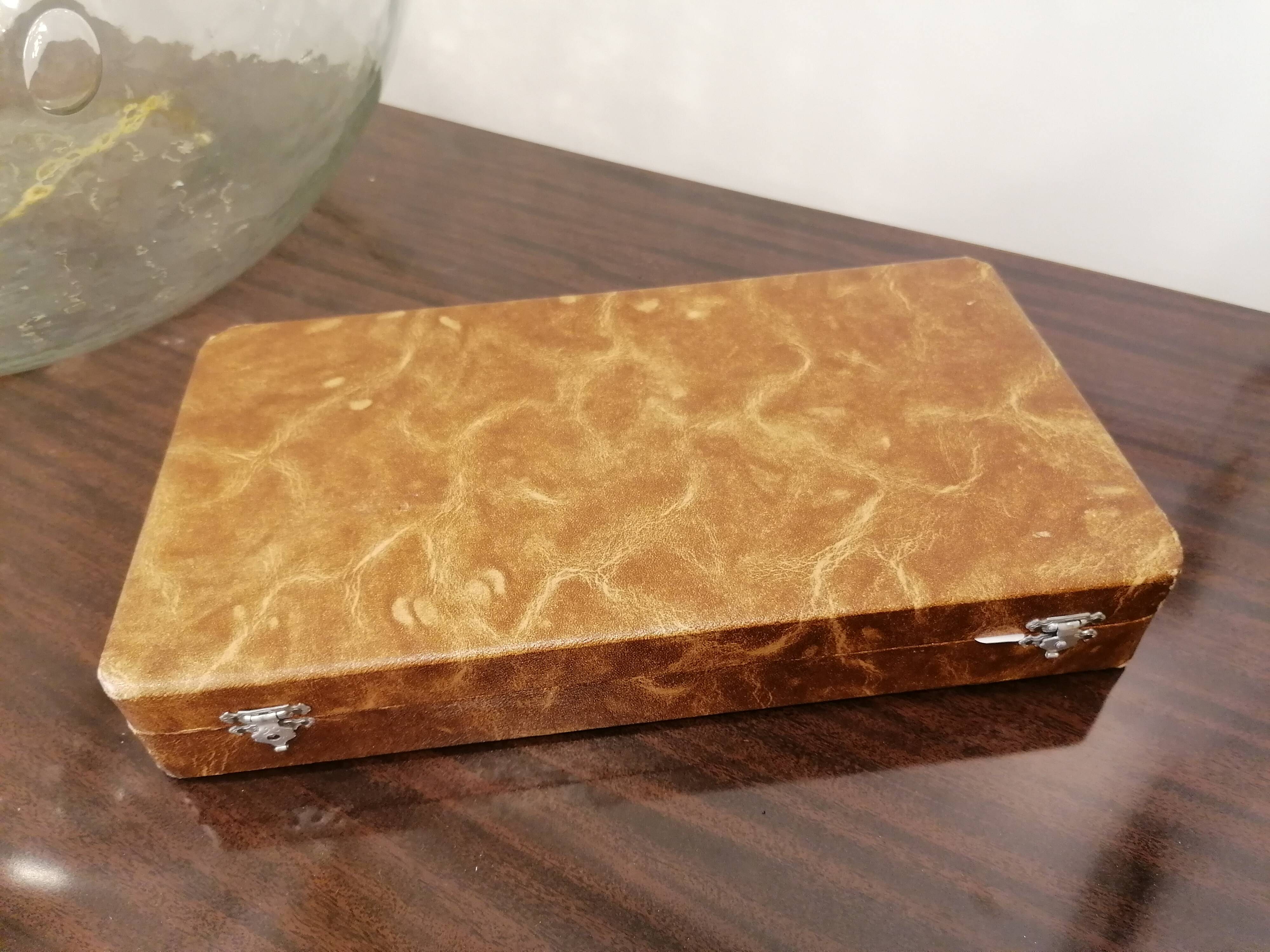 Box of 11 stainless steel knives with bakelite handles