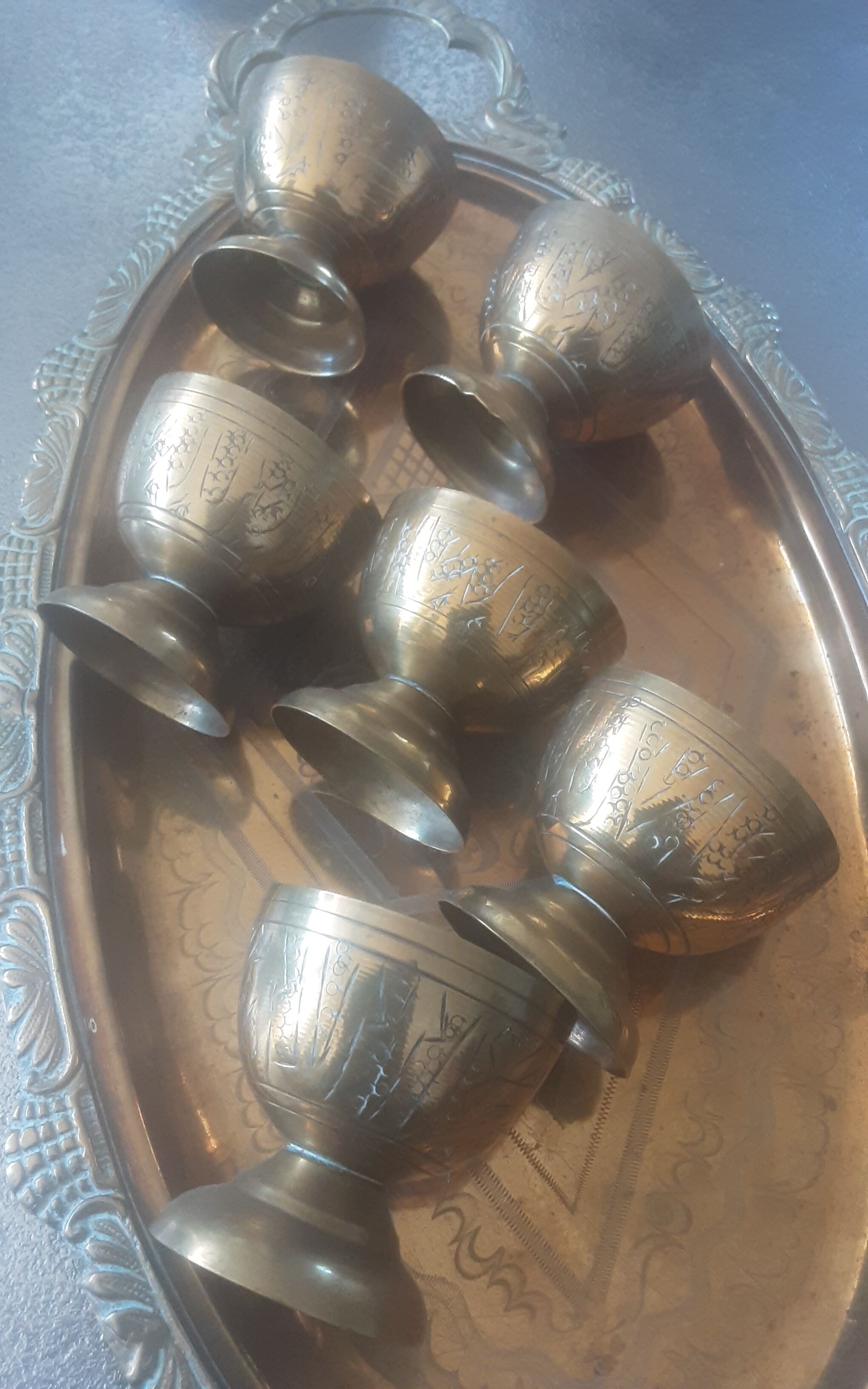Old service porcelain brass cups